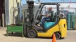 man driving forklift