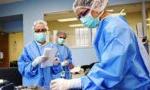 Surgical Tech students working together in scrubs