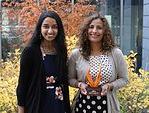 Loredana Cooper holding award with Saheli Sheth standing outdoors on fall day